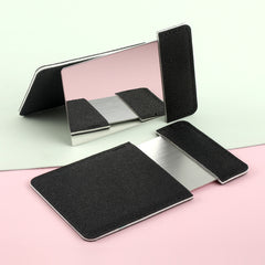 Square stainless steel single-sided mirror with a leather shell. The shell is available in black, red or pink. The size is 63* 95mm.