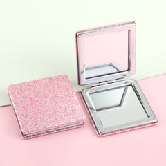 The silver plated square loose powder mirror has a size of 70*70 mm. One side is normal and the other side is doubled in magnification. It is available in gold, pink, rose red, and black. You can customize your own pattern and logo.