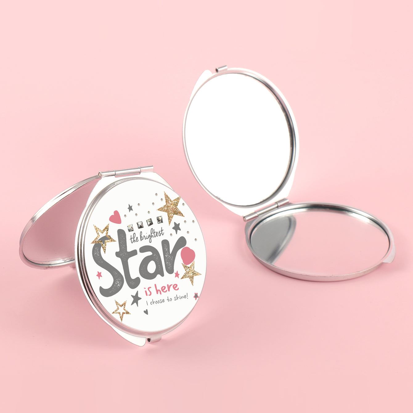 The silver plated round double-sided makeup mirror has a colored glue drop pattern. One side is normal size and the other side is double enlarged. You can customize the pattern yourself.