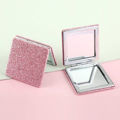 The silver plated square loose powder mirror has a size of 70*70 mm. One side is normal and the other side is doubled in magnification. It is available in gold, pink, rose red, and black. You can customize your own pattern and logo.