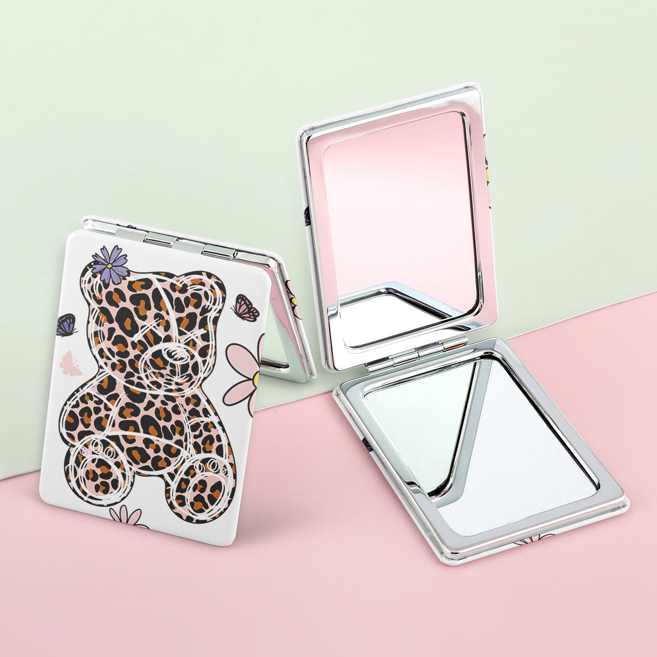 A rectangular color printed double-sided PU leather mirror with a silver plated frame. One side is normal and the other side is doubled in size. You can customize your own pattern.