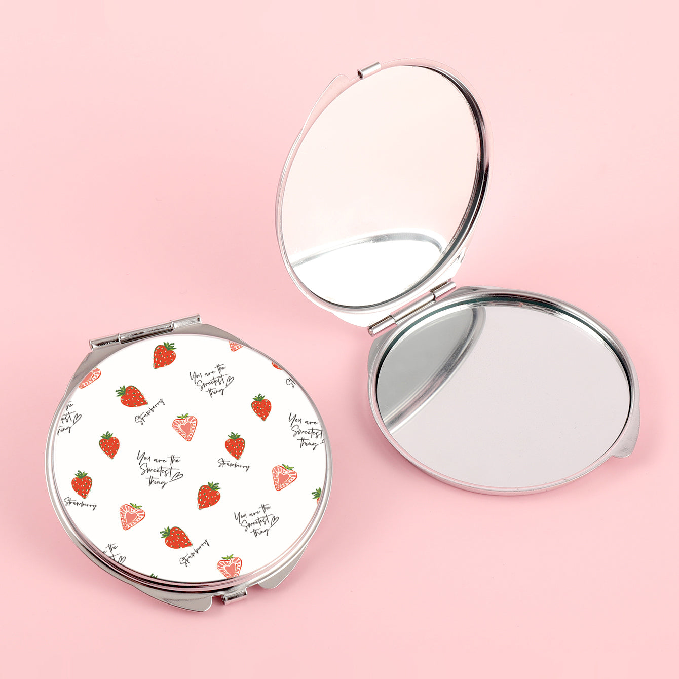 The silver plated round double-sided makeup mirror has a colored glue drop pattern. One side is normal size and the other side is double enlarged. You can customize the pattern yourself.