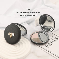 7cm Double-Sided Macaron Shaped Makeup Mirror with Silver-Plated Metal Frame – the ultimate gift for friends on holidays and birthdays! 🎁 In stock: black, red, pink, and beige. Adorned with a charming metallic Bee.