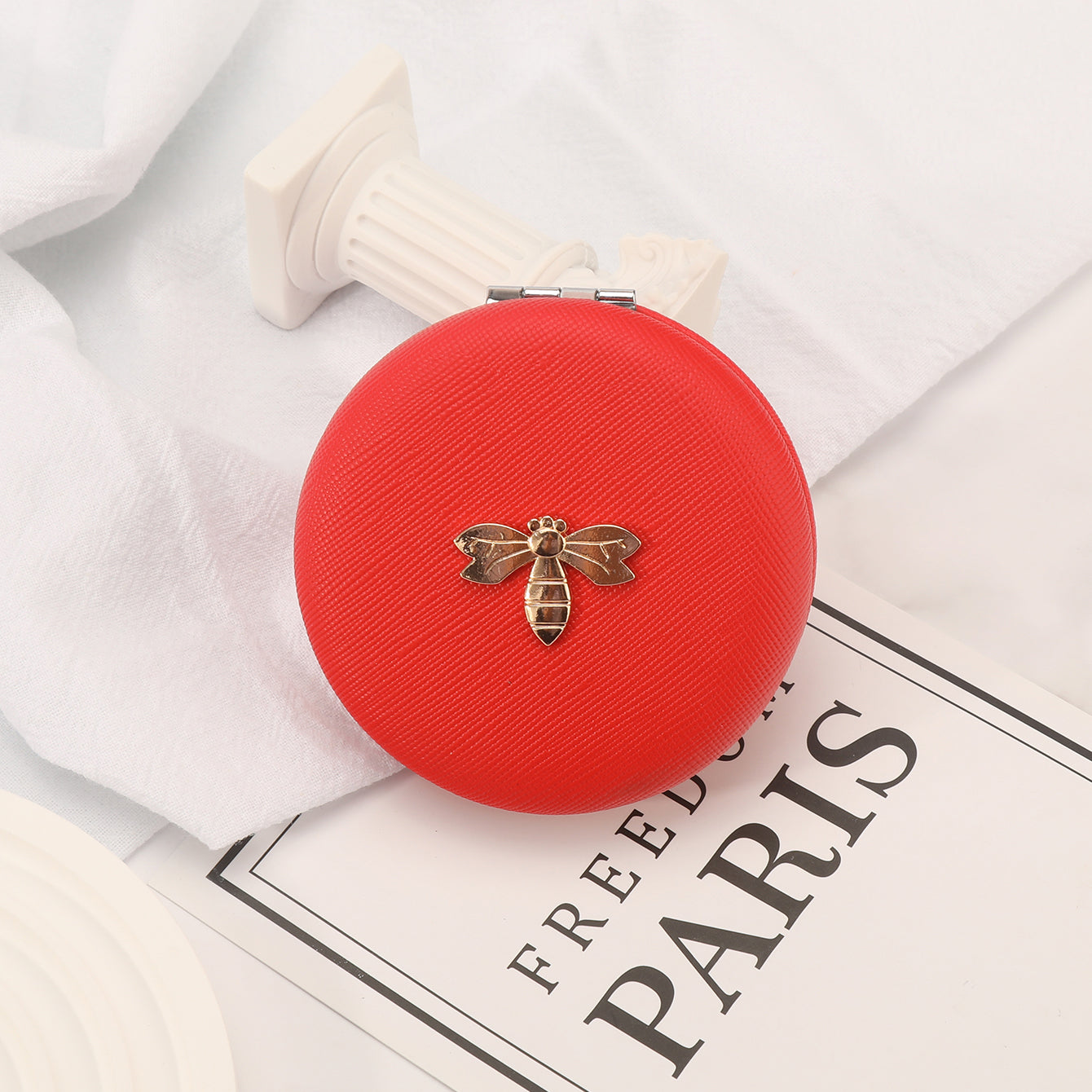 7cm Double-Sided Macaron Shaped Makeup Mirror with Silver-Plated Metal Frame – the ultimate gift for friends on holidays and birthdays! 🎁 In stock: black, red, pink, and beige. Adorned with a charming metallic Bee.