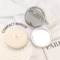 7cm Double-Sided Macaron Shaped Makeup Mirror with Silver-Plated Metal Frame – the ultimate gift for friends on holidays and birthdays! 🎁 In stock: black, red, pink, and beige. Adorned with a charming metallic Bee.