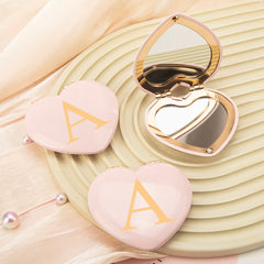 Rose Gold-Plated Heart-Shaped Mirrors with Printed Letters. Exquisite packaging, in stock, and available for mixed batches. Perfect for wholesale, international trade, and beauty industry clients. Elevate your inventory now!