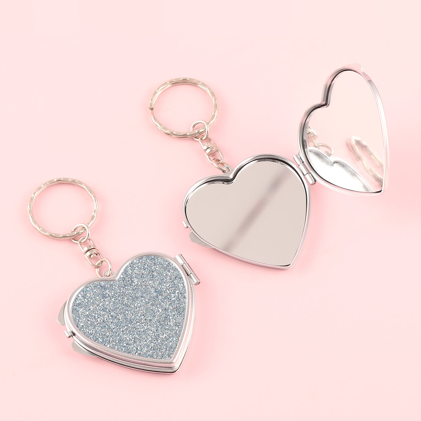 ✨Chic Heart Keychain Mirror: Dual-sided glass, silver electroplating, compact 50mm size. PU glitter leather surface in Black, Gold, Blue, Silver, Pink, Red. Elevate your on-the-go makeup with style!💄🔑