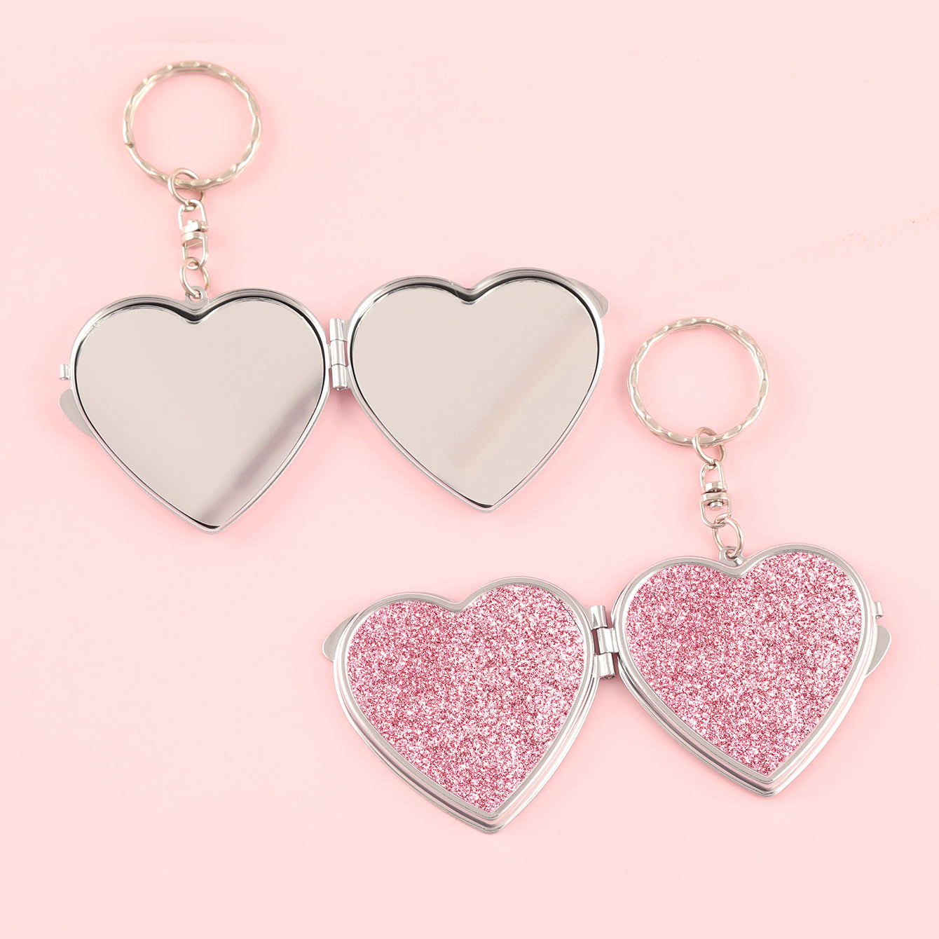 ✨Chic Heart Keychain Mirror: Dual-sided glass, silver electroplating, compact 50mm size. PU glitter leather surface in Black, Gold, Blue, Silver, Pink, Red. Elevate your on-the-go makeup with style!💄🔑