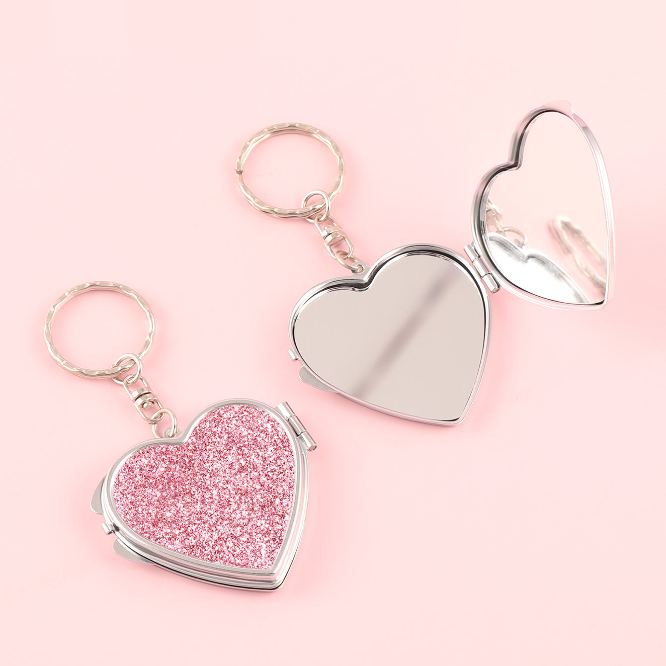 ✨Chic Heart Keychain Mirror: Dual-sided glass, silver electroplating, compact 50mm size. PU glitter leather surface in Black, Gold, Blue, Silver, Pink, Red. Elevate your on-the-go makeup with style!💄🔑