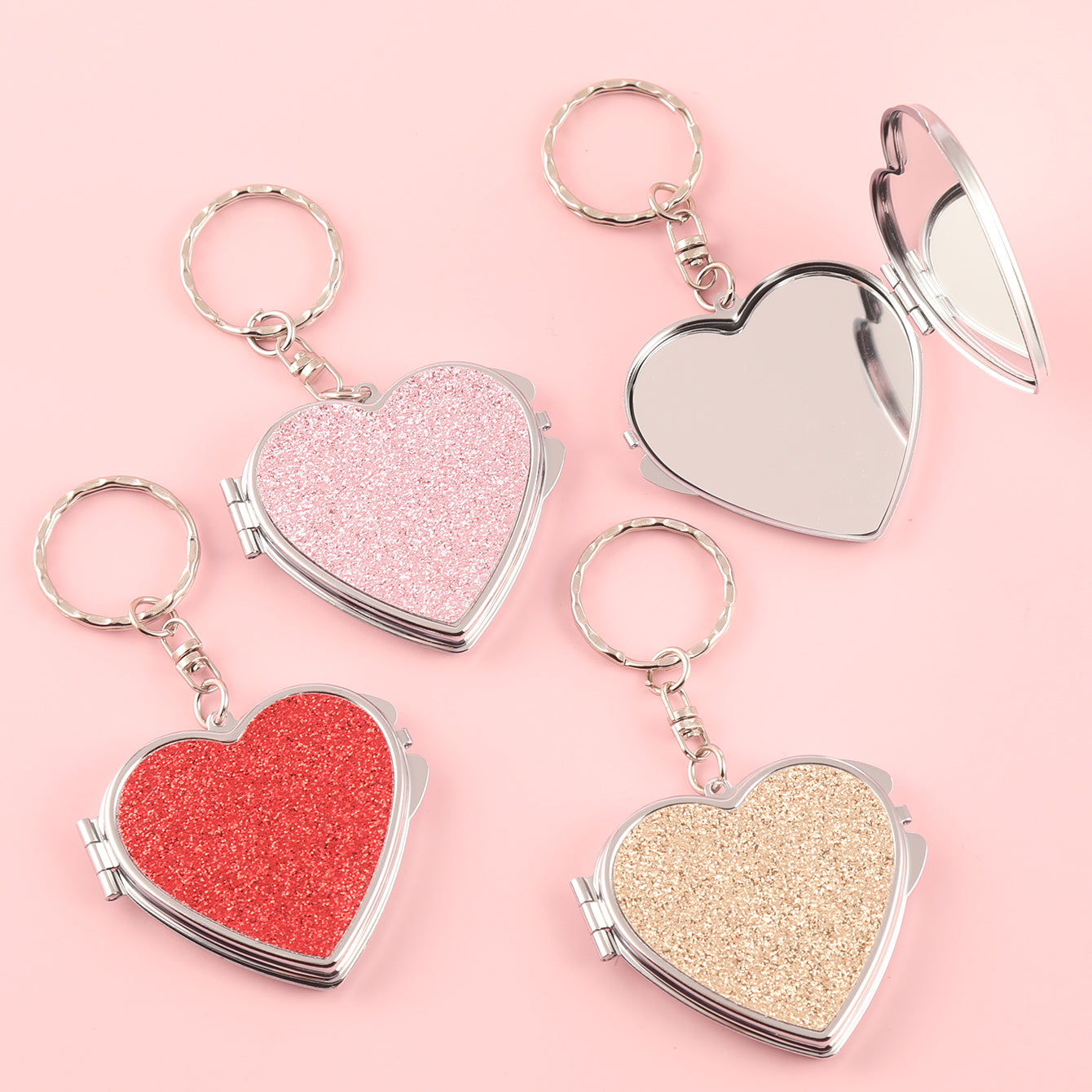 ✨Chic Heart Keychain Mirror: Dual-sided glass, silver electroplating, compact 50mm size. PU glitter leather surface in Black, Gold, Blue, Silver, Pink, Red. Elevate your on-the-go makeup with style!💄🔑