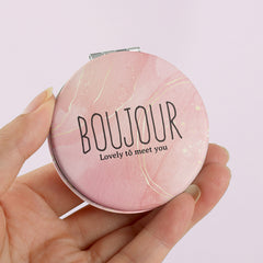 ✨ Elevate Your Style with Boujour ✨ — 60mm Circular Double-Sided Portable Makeup Mirror featuring chic INS-style lettering, 2x magnification, and sleek silver electroplating. In-stock and ready to ship, it's the perfect holiday gift for your friends!