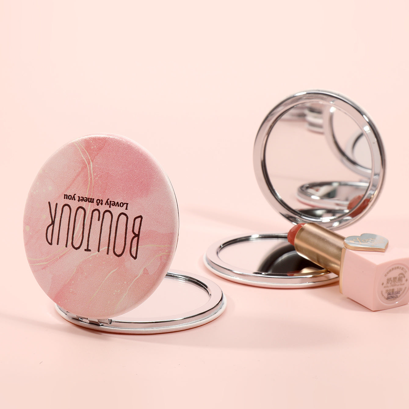 ✨ Elevate Your Style with Boujour ✨ — 60mm Circular Double-Sided Portable Makeup Mirror featuring chic INS-style lettering, 2x magnification, and sleek silver electroplating. In-stock and ready to ship, it's the perfect holiday gift for your friends!