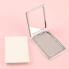 "Stylish White PU Leather-Wrapped Rectangular Mirror with Silver Electroplated Frame: Ideal Gift, Sized 85x62mm!"