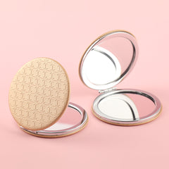 Beautiful Round Plating Silver Frame, Cross-Pattern PU Eco-Friendly Leather Embellishment, HD 60*60mm Makeup Mirror, Clearly Showing the Details of Makeup, The Perfect Choice for Both Fashion and Environmental Protection.