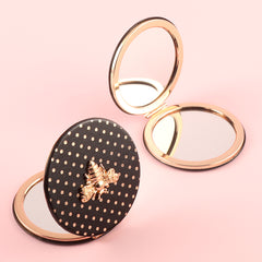 Stylish And Compact 70*70mm Round Cosmetic Mirror, PU Eco-Friendly Leather And Spot Pattern Complement Each Other, The Little Bee Metal Embellishment Adds A Sense Of Playfulness, And The Plating Gold Frame Has A High-End Feel