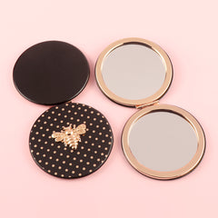 Stylish And Compact 70*70mm Round Cosmetic Mirror, PU Eco-Friendly Leather And Spot Pattern Complement Each Other, The Little Bee Metal Embellishment Adds A Sense Of Playfulness, And The Plating Gold Frame Has A High-End Feel