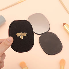 PU Eco-Friendly Leather with Bee Metal Decoration. Stainless Steel Cosmetic Mirror, 80*65mm Oval, Available in White, Pink, Light Pink, and Khaki.