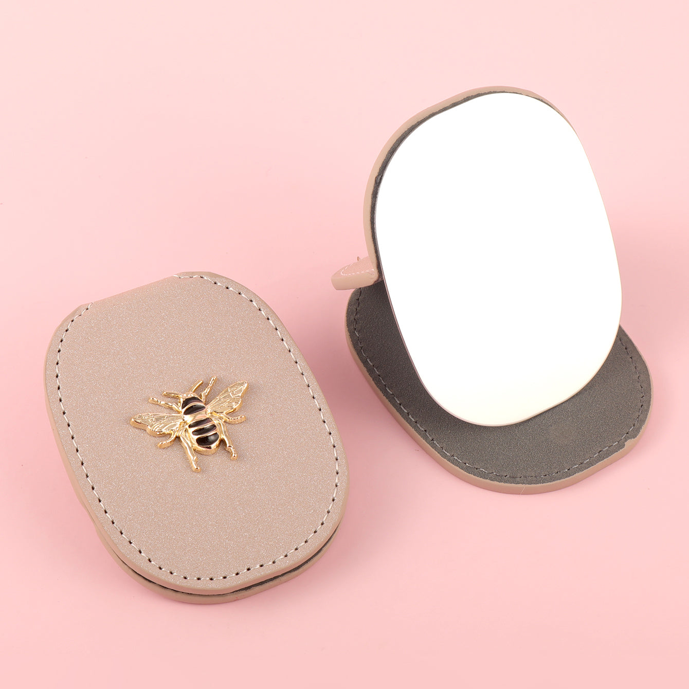 PU Eco-Friendly Leather with Bee Metal Decoration. Stainless Steel Cosmetic Mirror, 80*65mm Oval, Available in White, Pink, Light Pink, and Khaki.